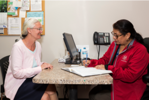 A member of the staff with a client
